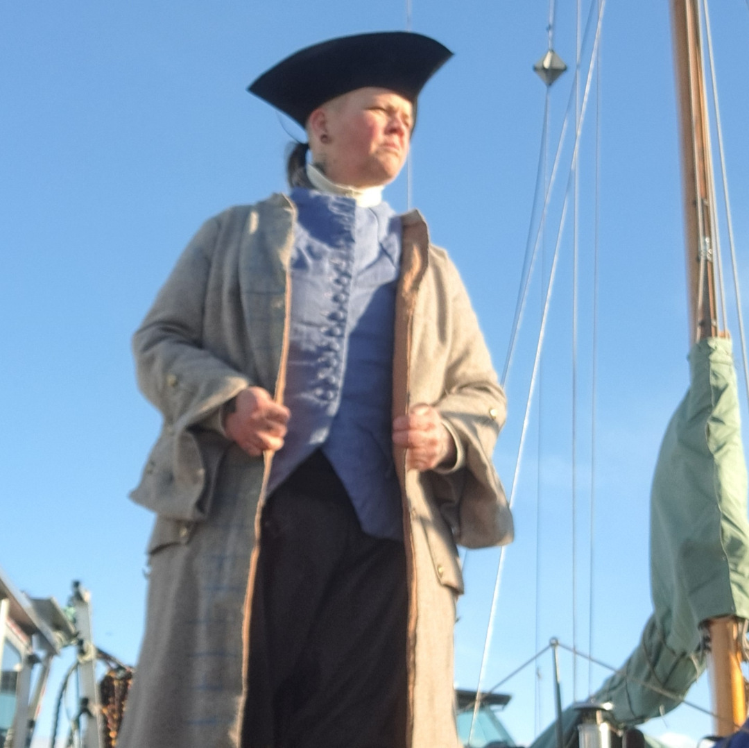 Captain Daphne in 18th-century attire